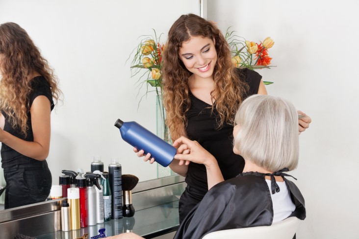 professional stylist using salon product